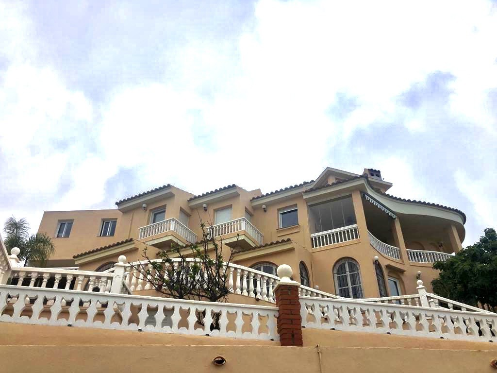 Spanish Mediterranean villa with terracotta roofs and terraces